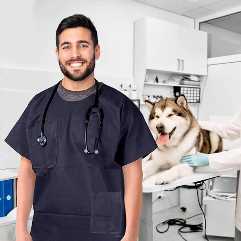Pack Of Ten Dark Blue Disposable Scrub Shirts Unisex Adult Large Lightweight Spunbond Polypropylene Short Sleeve Top With Double Chest Pockets Hospital Crew in a clinical setting.