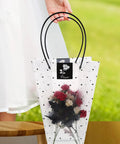 Flower Bouquet Wrap Bag With Handle For Easy Carry And Display shown with roses inside, ideal for floral arrangements and gift wrapping.