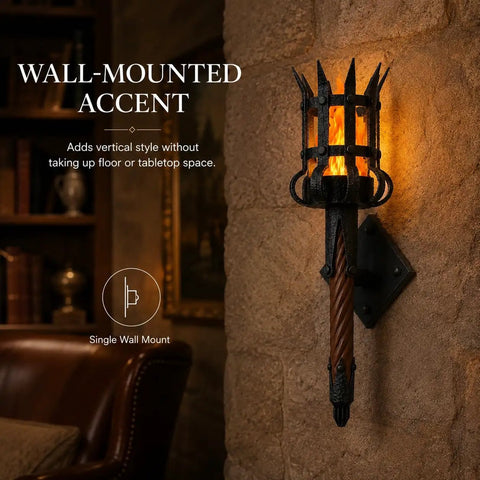 Medieval LED Torch Wall Sconce, Gothic Castle Flame-Effect Lamp mounted on stone wall with flame glow and brown shaft.