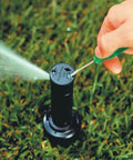 Adjusting Nozzle Pack 32SA Replacement Set Of 6 Self Aligning Sprinkler Nozzles in use on lawn for irrigation