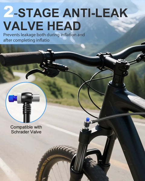 Pro Grade High Pressure Bike Shock Pump With Gauge, 300 PSI Max, attached to Schrader valve on mountain bike fork, scenic backdrop