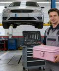 Technician holding a Badass Pink Metal Toolbox With Reliable Locking Latch Built Tough for garage use and repairs.