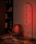 Dope RGB Color Changing Floor Lamp With Arching Three-Ring Pendant in dimly lit living room, red LED glow, sleek black finish