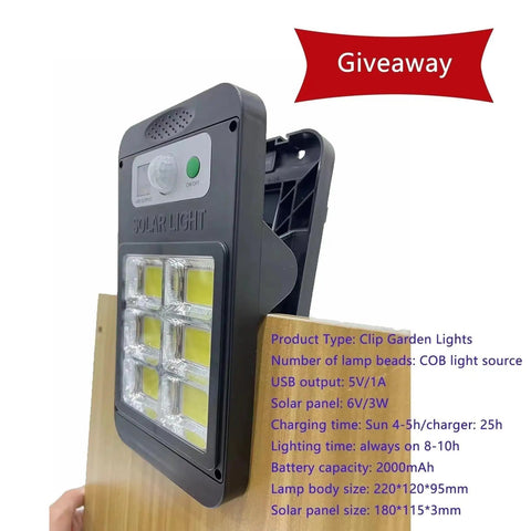 Solar clip garden light with COB light source and USB output on wooden board with giveaway banner