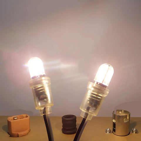 Two Top Tier Dope E10 LED Light Bulbs 5 Pack 6V Cold White 6500K showing clear covers and miniature screw bases.
