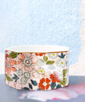 Ceramic Paper Clip Holder With Gold Line Dispenser, Desk Organizer with pink floral pattern on a light background
