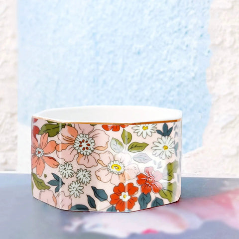 Ceramic Paper Clip Holder With Gold Line Dispenser, Desk Organizer with pink floral pattern on a light background