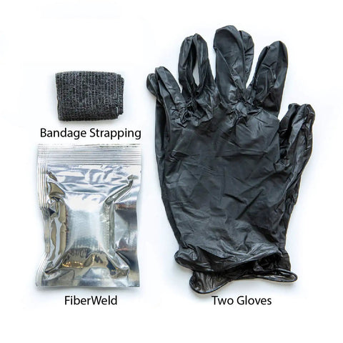 FiberWeld Automotive Repair Cast Kit Black 2 Inch Wide By 36 Inch Long Fiberglass Wrap With Resin laid out with gloves.