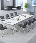 Lightweight Folding Mobile Computer Desk With Locking Wheels Steel Flip Frame Laptop Station with sliding casters in modern office setup.