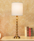 Gold Buffet Lamps Set Of 2 Tall Skinny Candlestick Style Lamps For Living Room And Dining Room on an ornate side table