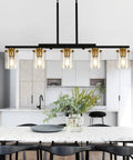 Top Notch Five Light Dining Room Fixture Featuring Clear Glass Shades That Give Any Kitchen Island A Kickin Farmhouse Chandelier Vibe While Building Sweet Warm Ambiance For Gatherings in a modern kitchen setting.