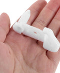 Awesome Fridge Door Stop Latch That Kills Noise And Stops Bumps With A Tough Plastic Clip held in a hand for perspective.