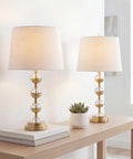 Clear Brass Gold Crystal LED Table Lamps Set of 2 on wooden desk with white linen drum shade and energy saving LED bulbs