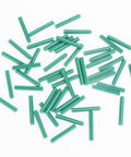 100 Pack 7mm One Quarter Inch Plastic Expansion Anchors 50mm Length Heavy Duty Green PE Wall Plugs scattered on a white surface