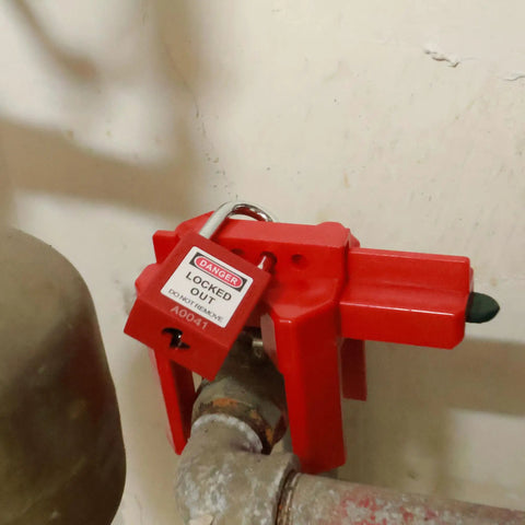 Adjustable Ball Valve Lockout Device For Half To Two And A Half Inch Valves installed on pipeline with lockout padlock