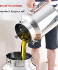 Kick Your Pantry Game Up With This Badass 304 Stainless Steel Milk Can Storage Container Featuring A Secure Tight Lid And Drip Free Spigot Tap Perfect For Bulk Rice Flour Sugar Coffee Beans At Full 16.9 Gallon Capacity, pouring oil from stainless steel can.