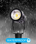 Close-up of single light from 10 Pack 3W RGB Landscape Spotlight Kit With Remote Control 12V Low Voltage LED in rain, waterproof feature