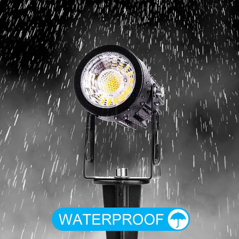 Close-up of single light from 10 Pack 3W RGB Landscape Spotlight Kit With Remote Control 12V Low Voltage LED in rain, waterproof feature