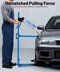 Mechanic using upgraded car dent repair tools kit for auto body restoration paintless dent removal on a silver car