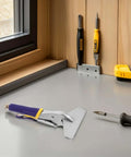 Pro Grade Hand Seamer For Sheet Metal Bending Pliers With Flat Jaw Grip on workspace near screwdrivers