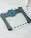 Digital Bathroom Scale With BMI Tracking And Calorie Intake, 440 Pound Capacity, 0.1 Pound Increments on marble floor