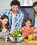 Family preparing salad together with Party Ready Stainless Steel Double Wall Dip Chiller Bowl 70 Oz for serving foods.