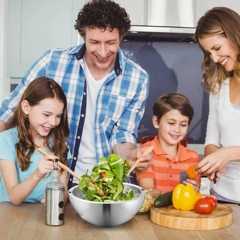 Family preparing salad together with Party Ready Stainless Steel Double Wall Dip Chiller Bowl 70 Oz for serving foods.