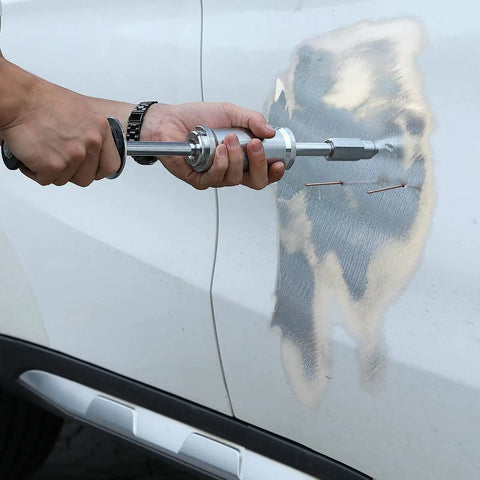 Person using Stud Welder Dent Repair Kit For Auto Body Fixes, 800W Spot Welder with 5 Welding Modes on car panel dent