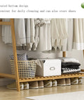 Workhorse Heavy Duty Clothes Rack With Double Shelf Built Tough Hanging Organizer For Winter Coats And Casual Wear showing elevated bottom with storage.