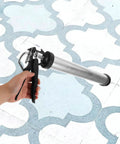 Built Tough As Nails Metal Caulk Smoothing Tool With Thick Reinforced Rod For Precision Sealant Bead Control Pro Finish in use on tiled surface.