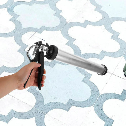 Built Tough As Nails Metal Caulk Smoothing Tool With Thick Reinforced Rod For Precision Sealant Bead Control Pro Finish in use on tiled surface.