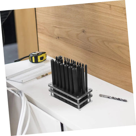 28-Piece Cylindrical Punch Set for Positioning Drilling and Mechanical Repairs on white workbench with measuring tape nearby
