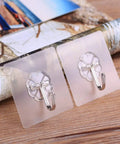 Tough As Nails Adhesive Wall Hooks Heavy Duty Sticky Hangers For Kitchen Living Room Bedroom And Dorm Skip The Drill Stainless Steel hooks on clear bases.