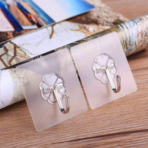 Tough As Nails Adhesive Wall Hooks Heavy Duty Sticky Hangers For Kitchen Living Room Bedroom And Dorm Skip The Drill Stainless Steel hooks on clear bases.