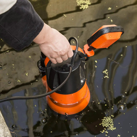 Hand adjusting 1HP Submersible Sump Pump With Automatic Float Switch, 3700GPH Clean Or Dirty Water Pump, orange, in water