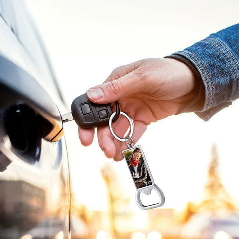 Person holding car key with 10 Pack Sublimation Bottle Opener Blanks Key Rings Aluminum Dope Heat Transfer Metal Bottle Opener Tags