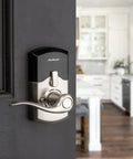 SmartCode 917 Keypad Keyless Entry Lever Deadbolt For Home in satin nickel on door with Tustin handle in modern kitchen