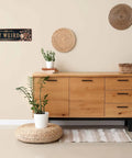 Snag This Sick Vintage Metal Tin Sign Keep It Weird Wall Decor Plaque 4x16 Inches above a wooden side table with plants.