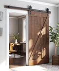 Beefed Up Heavy Duty Sliding Barn Door Hardware Kit Black Steel Track System With Industrial Bigwheel Hangers installed in room