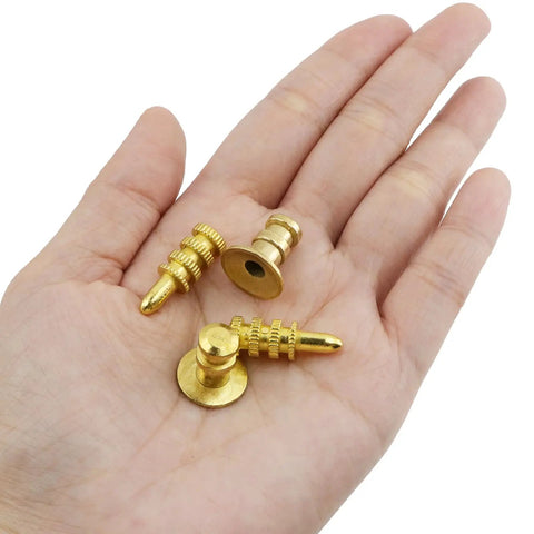 3 gold alignment pins in a hand from the 20 Piece Zinc Alloy Table Leaf Connector Kit Featuring Tight Alignment Pins And Heavy Duty Metal Sleeves For Reliable Extension Table Hardware Upgrades And Quick No Sweat Assembly.