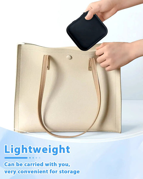 Lightweight beige leather tote bag with long handles and small black pouch for convenient storage.