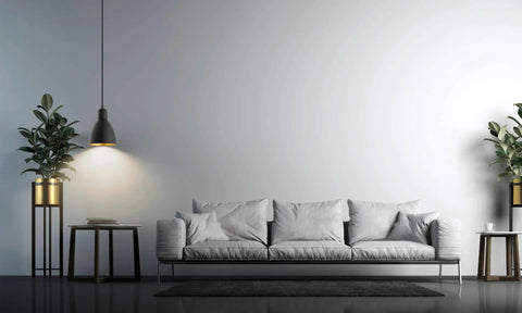 Priddy 1-Light Mini Pendant With Steel Shade Black And Gold for kitchen island, shown hanging over modern living room.