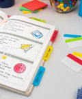 Sticky Tabs 2 In By 1.5 In Book Markers in Assorted Bright Colors for Reading, Annotation, Reminders, and Easy Organization, writable on a planner.