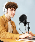 Person using Multifunctional Desktop Microphone Stand For Live Streaming And Studio Recording With Pop Filter Shock Mount Microphone Clip