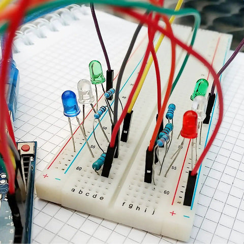 560 Piece Jumper Wire Kit For Breadboard Prototyping with assorted lengths, connected to LEDs on a breadboard for circuit building