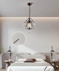 Modern Mini Crystal Chandelier With Iron Bronze Finish Ceiling Mount 1 Light Lighting Fixture illuminating a chic bedroom.