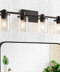 4 Light Modern Vanity Light With Industrial Matte Black Finish And Clear Glass Shades above mirror in bathroom