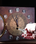 Person using Two Pack Wrench Clock Keys For Winding Clocks, 3.8mm Hole, 52mm Long Steel Clock Keys on a vintage clock