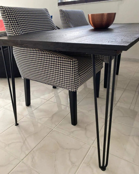 Table with 26 Inch Hairpin Table Leg Set With One Half Inch Diameter Three Rods Beefy Black Furniture Feet with chairs nearby.