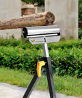 Roller Support Stand Twin Pack With 132 Lb Capacity Each, Heavy Duty Steel Roll Stand handling log outdoors in garden setup.